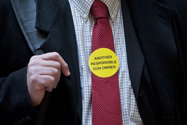 A "responsible gun owner" wears a sticker.